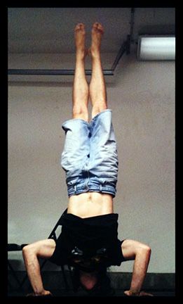 The wide stance makes these freestanding handstand pushups easier.