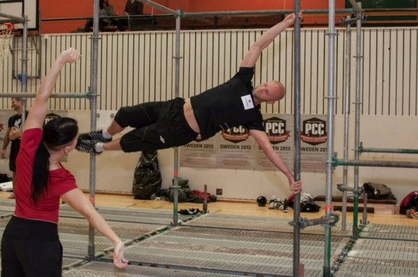 PCC Team Leader, Adrienne Harvey coaching the human flag at the PCC Workshop in Gothenburg Sweden 2013