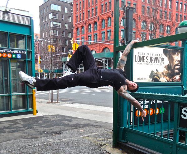Danny Kavadlo Performs a Human Flag in the streets of New York City