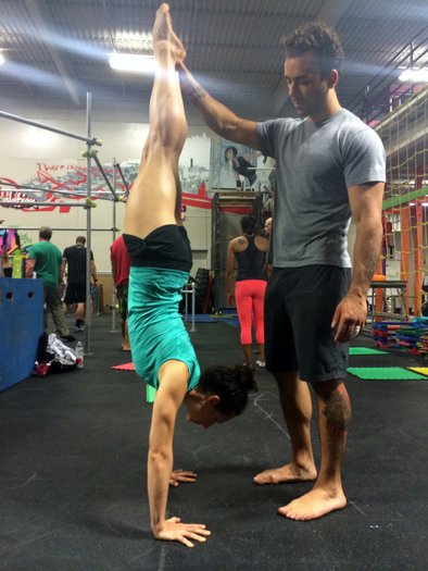 Angelo spotting Rosalia on her handstand at PCC Virginia